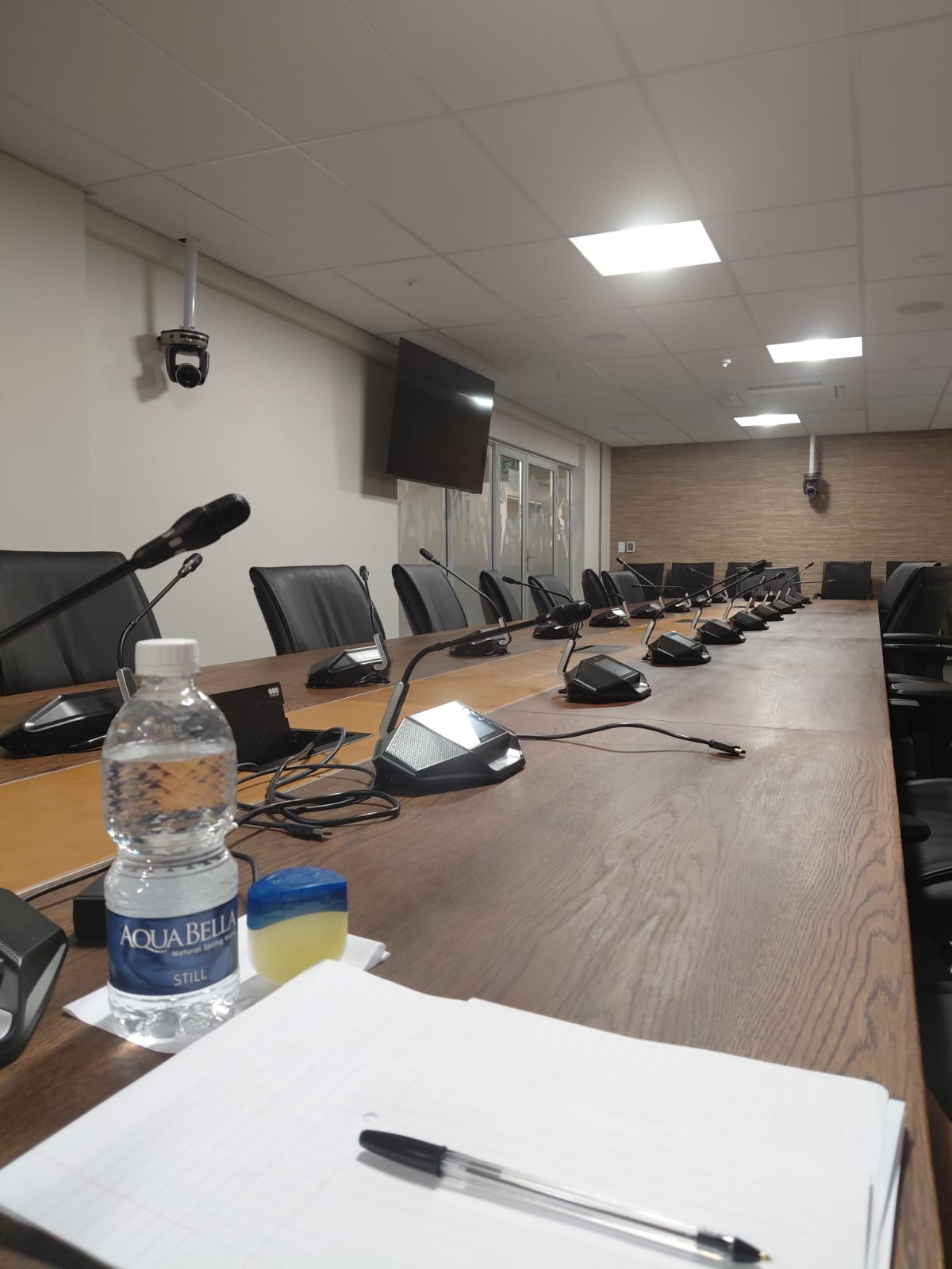 A boardroom table prepared for reflective professional discussion